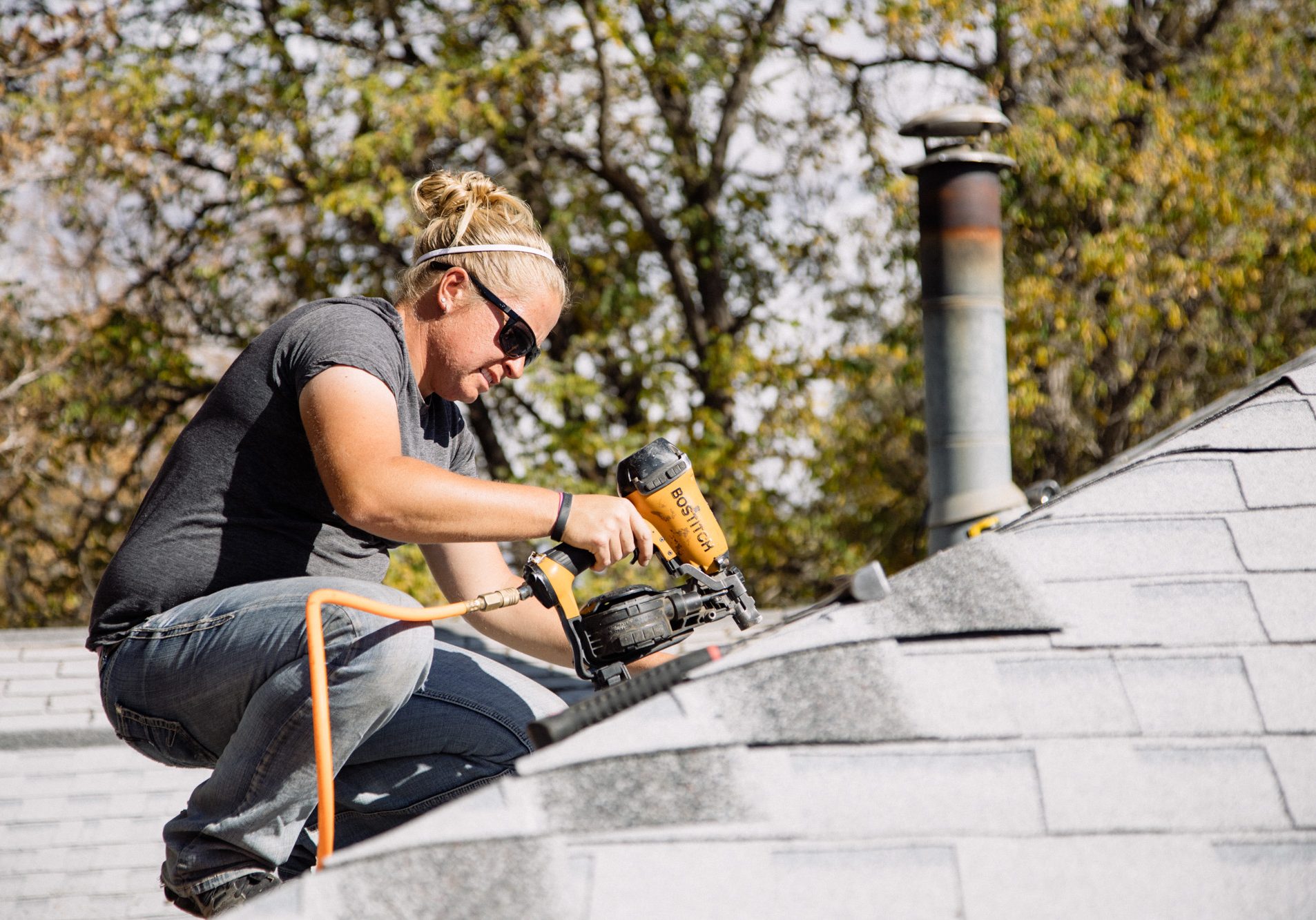 Housing Specialist Steph Crabtree roofing as a part of a Fix It First repair